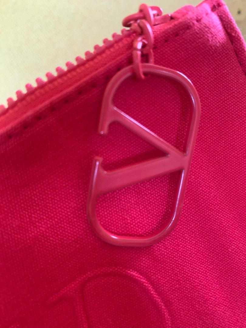 Valentino pouch/wallet (Category: Luxury Bags & Wallets) located in Las Pinas. Submitted by yolk.ph (Listing ID 1323281630, Image 2). Description: VALENTINO HOT PINK CANVAS POUCH Rating: 9/10 Almost new; looks unused and no flaws at all! With thin padding inside Bought from book off nagoya 💯.