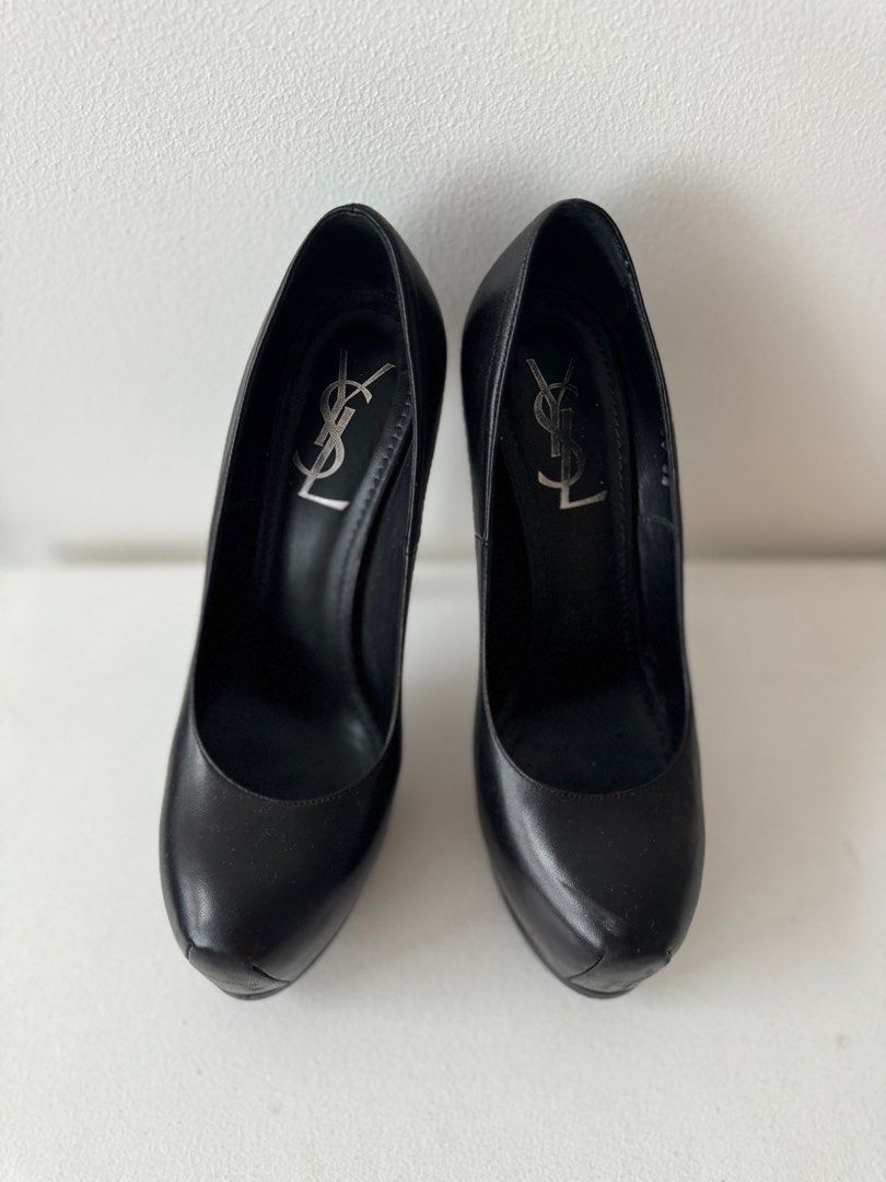 YSL Trib Too Pumps (Category: Heels) located in Makati City. Submitted by theladyluxxe (Listing ID 1323355451, Image 1). Description: Size 38 These perfect black leather pumps come with super high heels and platforms, to make a real style statement. Heel height: 10.5 cm.Heel height from ground: 14.5cm.Platform: 4cm. Excellent condition (9.5/10) Comes with dust bag .