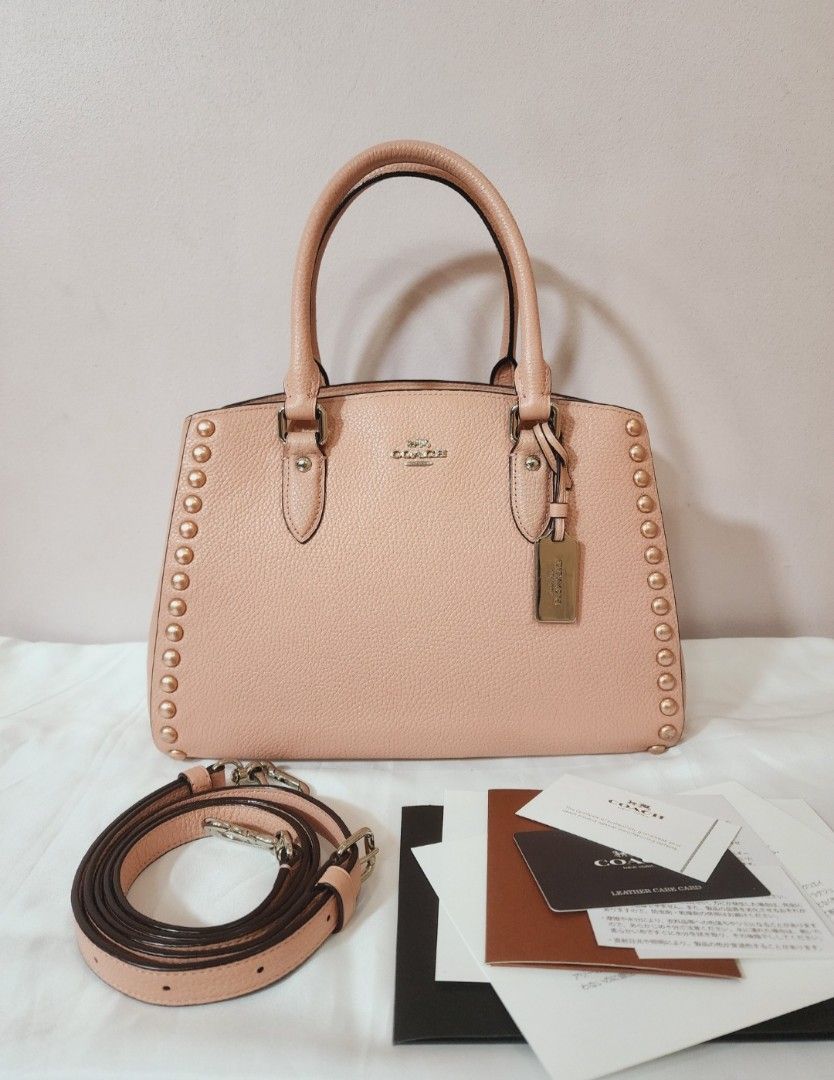 Coach Empire Lacquer Rivets Carryall Satchel Bag (Category: Cross-body Bags) located in Valenzuela. Submitted by absolutelychick (Listing ID 1326601908, Image 1). Description: L 11" x W 5.75" x H 8" with original dustbag jrs, lbc, j&t lalamove/grab ready.