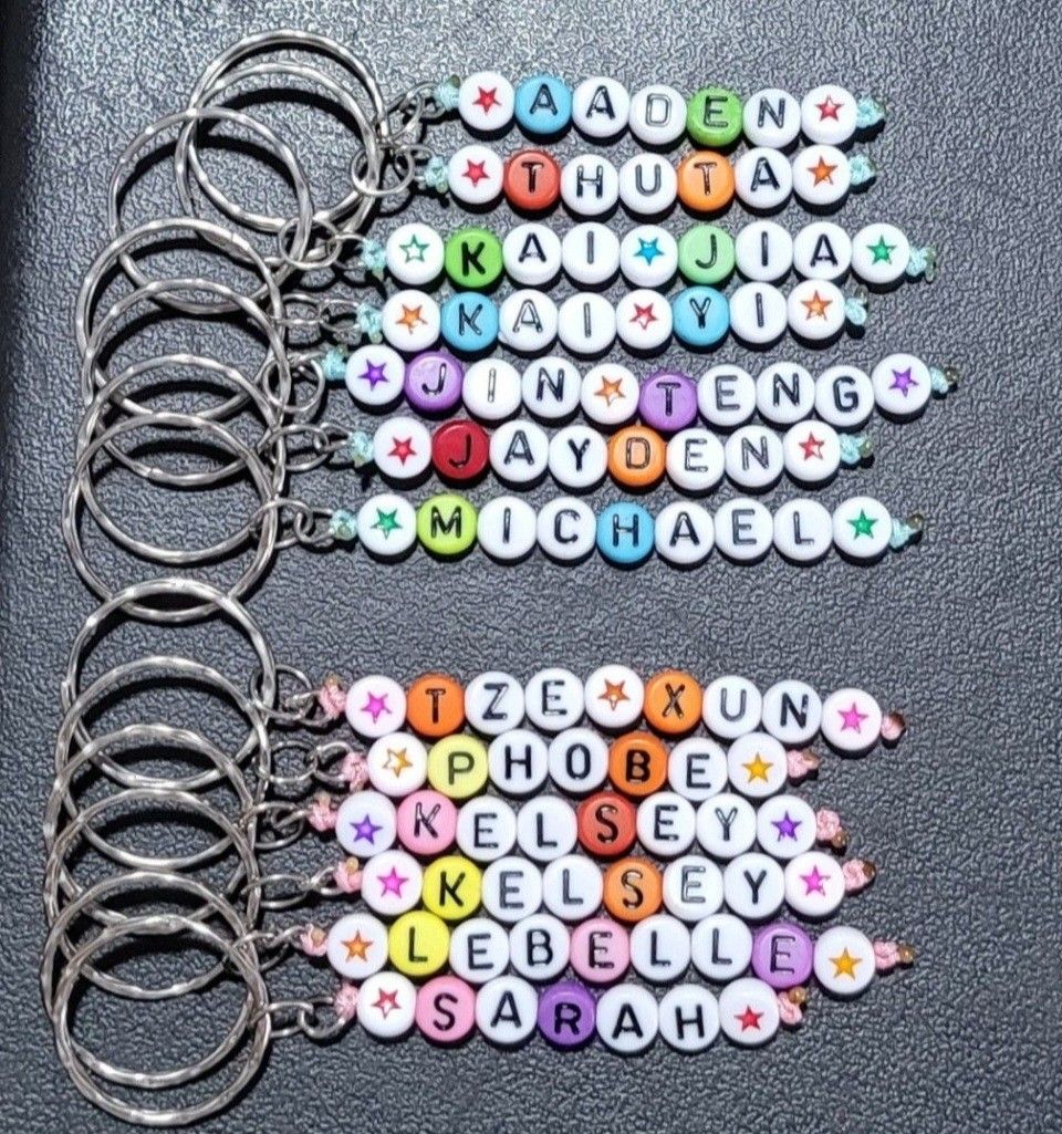 CUSTOMISED KEYCHAINS (Category: Handmade Craft) located in Singapore. Submitted by cwlmm (Listing ID 1326501843, Image 3). Description: Price is at $0.95 each. (Max letters of 10 including spaces(hearts), additional letters/spacing at $0.10 each) ***+$0.15 for individual packing each (MANDATORY)*** You can also choose to topup each keychain with a charm; Gummy Bears @$0.40/each Confetti Balls @ $0.50/each Crown @ $0.50/each Mode of collection: 1.