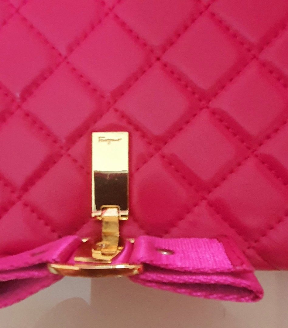 Ferra sling bag (Category: Luxury Bags & Wallets) located in Baguio. Submitted by callwan24792 (Listing ID 1326626559, Image 3). Description: Chic Quilted Handbag with Bow Accent Step out in style with this gorgeous pink quilted handbag featuring an elegant bow detail. The bag's luxurious quilted design, combined with its vibrant pink color, exudes femininity and sophistication. A gold-tone metal bow charm on the front adds a touch of glam, while