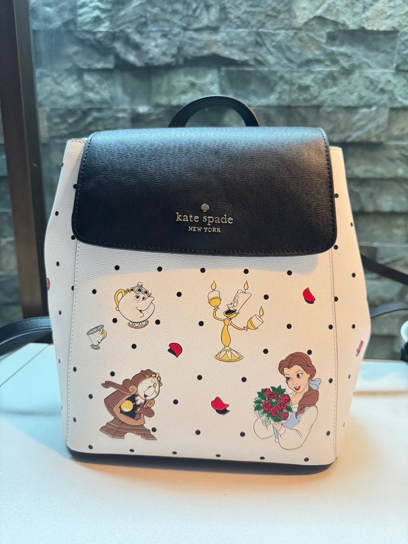 Kate Spade x Disney Backpack (Category: Backpacks) located in Pasig City. Submitted by n.mkl (Listing ID 1326562368, Image 1). Description: Measurements: 10.2” H x 4.8” D 8.6”W( BOTTOM) Features: Metal Pinmount Logo Closure Type: flap with magnetic snap closure Dust Bag Included: No Interior: back zip & front slip pockets .