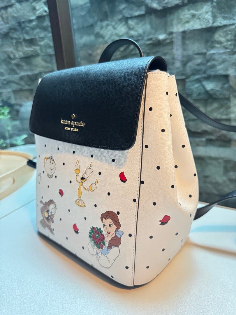 Kate Spade x Disney Backpack (Category: Backpacks) located in Pasig City. Submitted by n.mkl (Listing ID 1326562368, Image 2). Description: Measurements: 10.2” H x 4.8” D 8.6”W( BOTTOM) Features: Metal Pinmount Logo Closure Type: flap with magnetic snap closure Dust Bag Included: No Interior: back zip & front slip pockets .