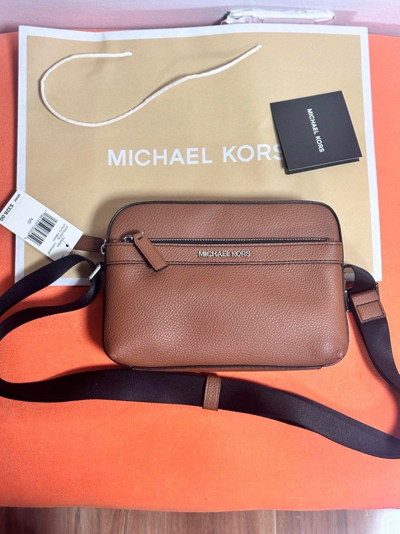 MK Cooper Brown Sling Bag (Category: Luxury Bags & Wallets) located in Paranaque City. Submitted by mars_eshoppe (Listing ID 1326593747, Image 1). Description: .