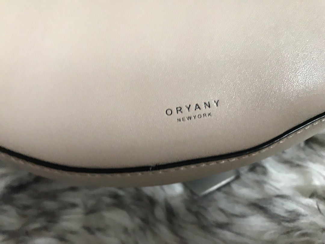 Oryany Rookie Saddle Bag (Category: Luxury Bags & Wallets) located in Muntinlupa City. Submitted by rina.rina3 (Listing ID 1326522086, Image 3). Description: Like new condition Oryany Rookie saddle bag Sourced from Korea Excellent gold hardwares and leather With zippered pocket and open pocket inside With detachable air pod pouch Adjustable wide strap Can be worn as kili bag, shoulder bag or crossbody bag Bag dimensions all in inches, LXWXH (bag 