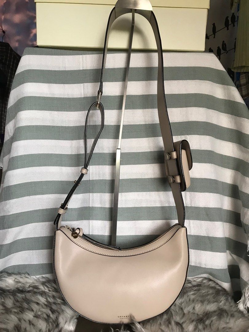 Oryany Rookie Saddle Bag (Category: Luxury Bags & Wallets) located in Muntinlupa City. Submitted by rina.rina3 (Listing ID 1326522086, Image 1). Description: Like new condition Oryany Rookie saddle bag Sourced from Korea Excellent gold hardwares and leather With zippered pocket and open pocket inside With detachable air pod pouch Adjustable wide strap Can be worn as kili bag, shoulder bag or crossbody bag Bag dimensions all in inches, LXWXH (bag 
