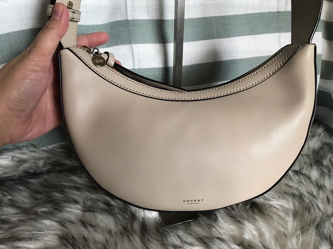 Oryany Rookie Saddle Bag (Category: Luxury Bags & Wallets) located in Muntinlupa City. Submitted by rina.rina3 (Listing ID 1326522086, Image 2). Description: Like new condition Oryany Rookie saddle bag Sourced from Korea Excellent gold hardwares and leather With zippered pocket and open pocket inside With detachable air pod pouch Adjustable wide strap Can be worn as kili bag, shoulder bag or crossbody bag Bag dimensions all in inches, LXWXH (bag 