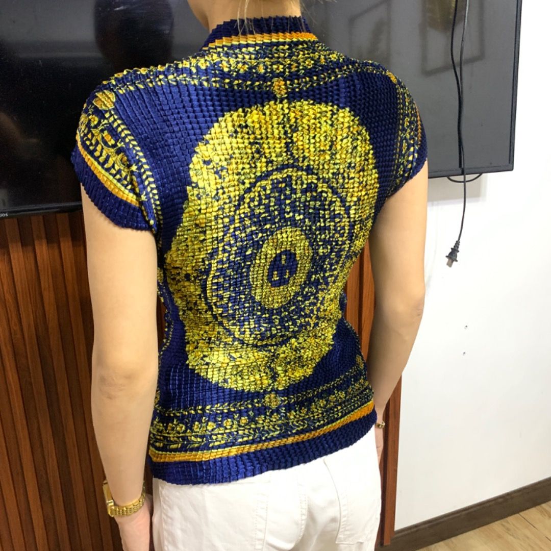 Versace Couture Pleated Baroque Top (Category: Luxury Apparel) located in Bacolod City. Submitted by boujee.wardrobes (Listing ID 1326742674, Image 2). Description: Vintage versace pleated silk top Baroque print Issey miyake pleats please alternative Model is around 5'1 can fit XS to M stretch Like new. No issues.