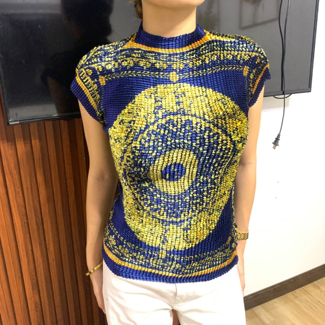 Versace Couture Pleated Baroque Top (Category: Luxury Apparel) located in Bacolod City. Submitted by boujee.wardrobes (Listing ID 1326742674, Image 1). Description: Vintage versace pleated silk top Baroque print Issey miyake pleats please alternative Model is around 5'1 can fit XS to M stretch Like new. No issues.