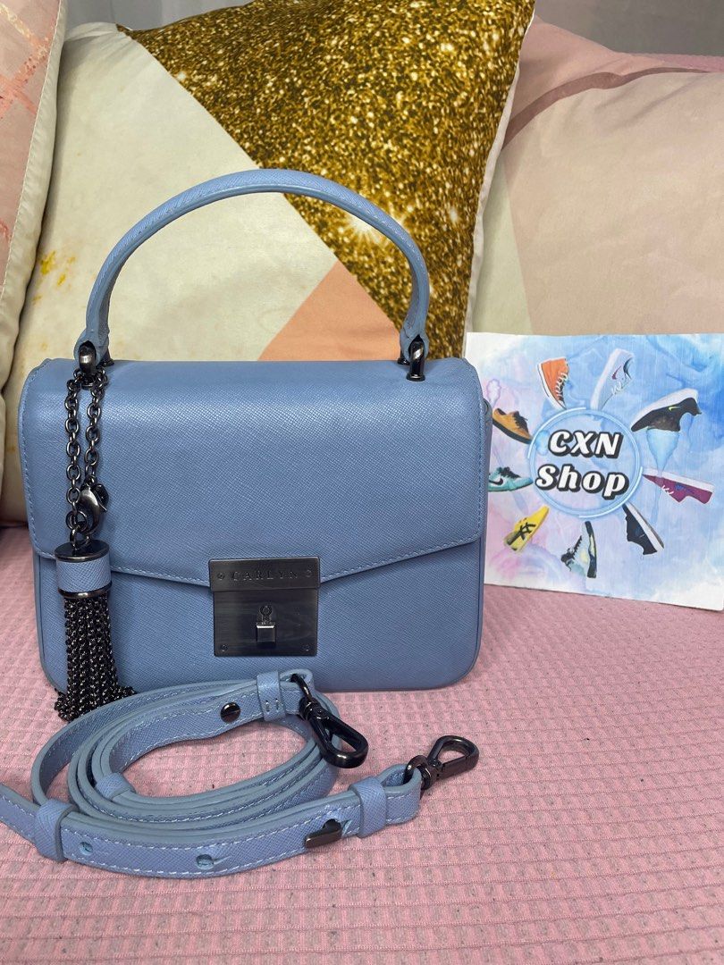 Carlyn Poppy Top-Handle Bag (Category: Cross-body Bags) located in Binan City. Submitted by cxn.shop (Listing ID 1326910819, Image 1). Description: PRELOVED 💖 Seldom used in very good condition Minimal signs of use With adjustable strap With authenticity card Genuine saffiano leather No flaws 100% ORIGINAL.