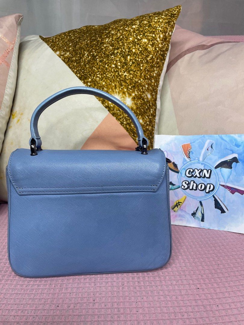 Carlyn Poppy Top-Handle Bag (Category: Cross-body Bags) located in Binan City. Submitted by cxn.shop (Listing ID 1326910819, Image 2). Description: PRELOVED 💖 Seldom used in very good condition Minimal signs of use With adjustable strap With authenticity card Genuine saffiano leather No flaws 100% ORIGINAL.