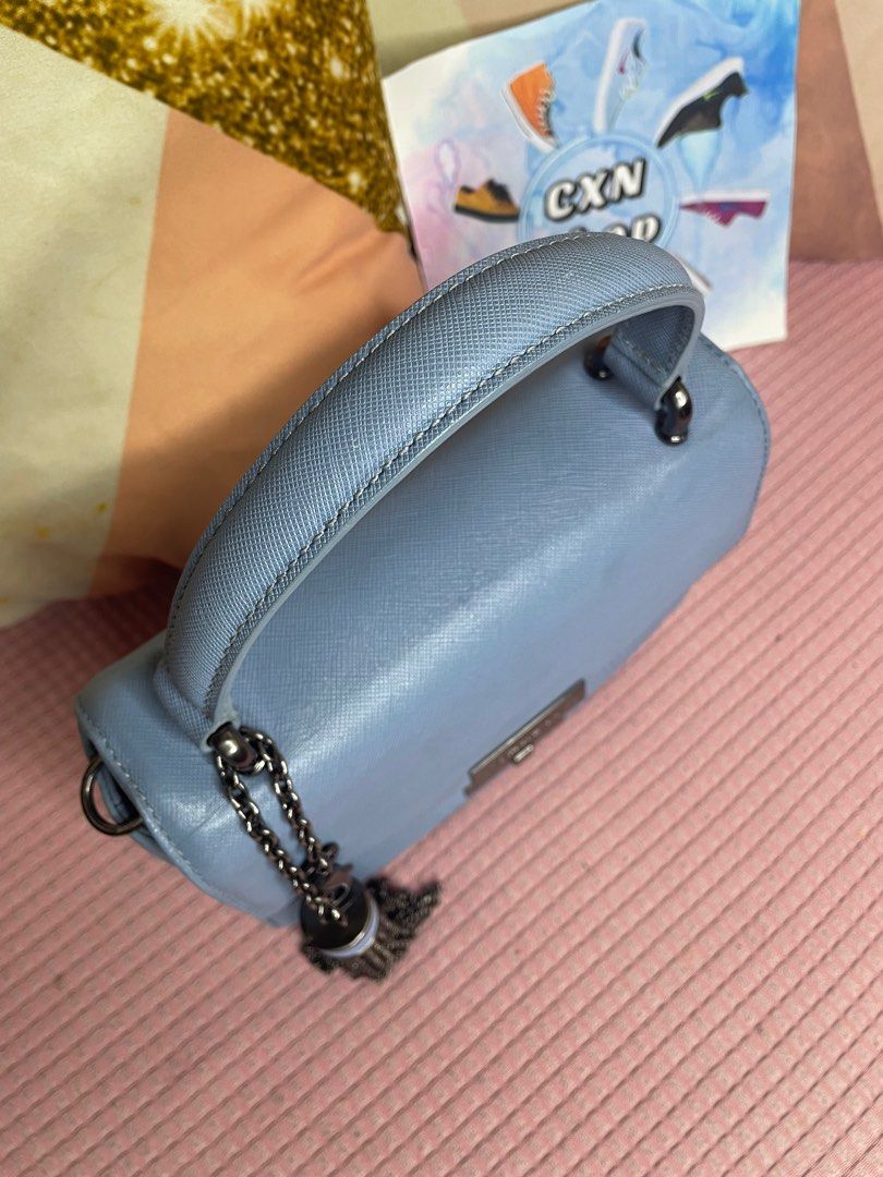 Carlyn Poppy Top-Handle Bag (Category: Cross-body Bags) located in Binan City. Submitted by cxn.shop (Listing ID 1326910819, Image 3). Description: PRELOVED 💖 Seldom used in very good condition Minimal signs of use With adjustable strap With authenticity card Genuine saffiano leather No flaws 100% ORIGINAL.