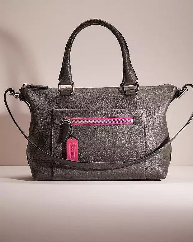 Coach Molly East West Satchel (Category: Luxury Bags & Wallets) located in Pasig City. Submitted by shopsmart.mnl (Listing ID 1326891004, Image 1). Description: Color is graphite berry 10/10 Looks new just missing tassle meron pala kasama I didn’t know But the bag is flawless inside and out Guaranteed original Measures 14” x 9” Fits ipad Pwede tawad pero wag naman OA super ganda neto .