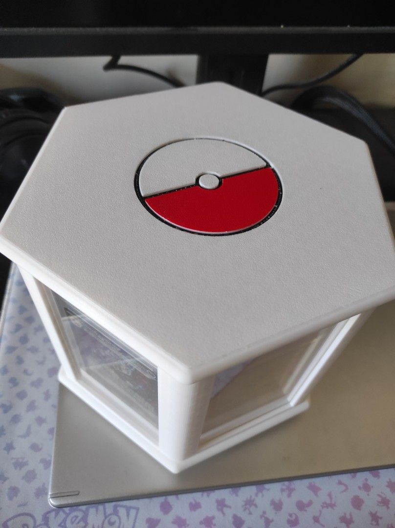 Custom 3D printed rotating PSA display (Category: Toys & Games) located in Singapore. Submitted by fadam3 (Listing ID 1326953731, Image 2). Description: Custom 3D printed rotating PSA display with acrylic window. Holds up to 6 PSA slabs. Top cover magnetically held to the display for quick and easy slab changes Do request for videos if required. Fits AGS slabs too. Last piece. no customisation. not printing anymore. Slabs NOT included..