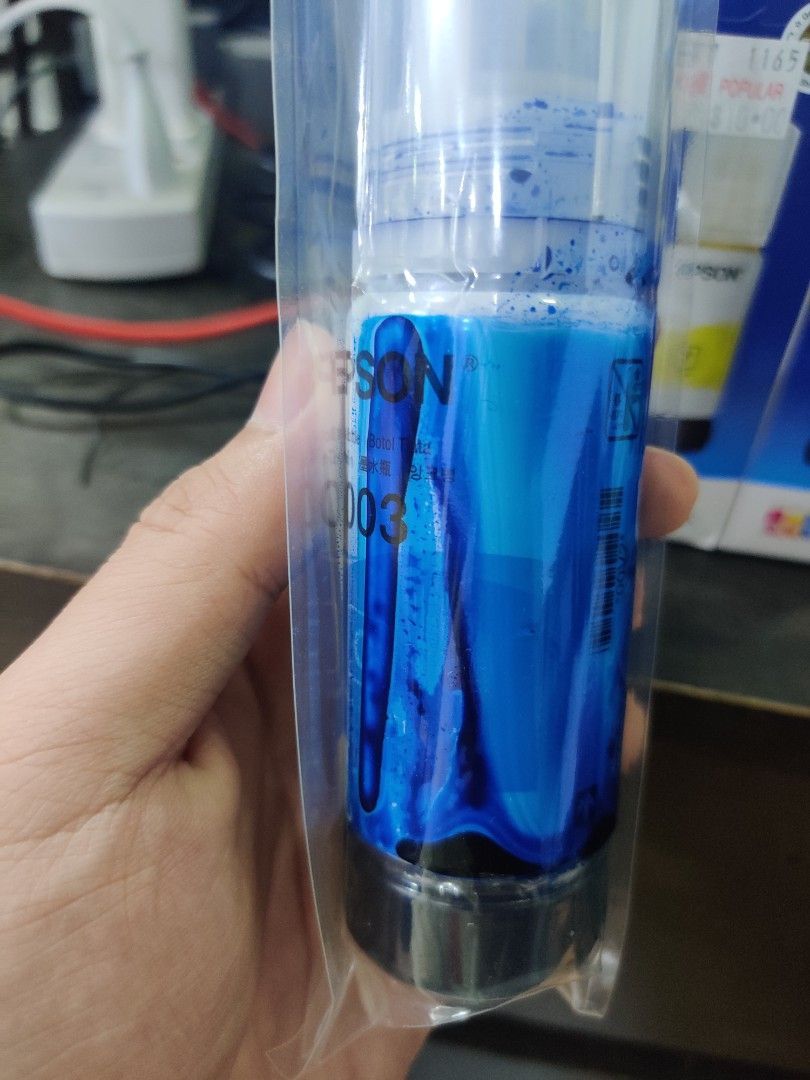 Epson Printer Ink (Category: Printers, Scanners & Copiers) located in Singapore. Submitted by hwangshoppe (Listing ID 1326864721, Image 3). Description: Epson 003 ink. 3 colours. brand new from popular. Blue ink spilled a little but still full..