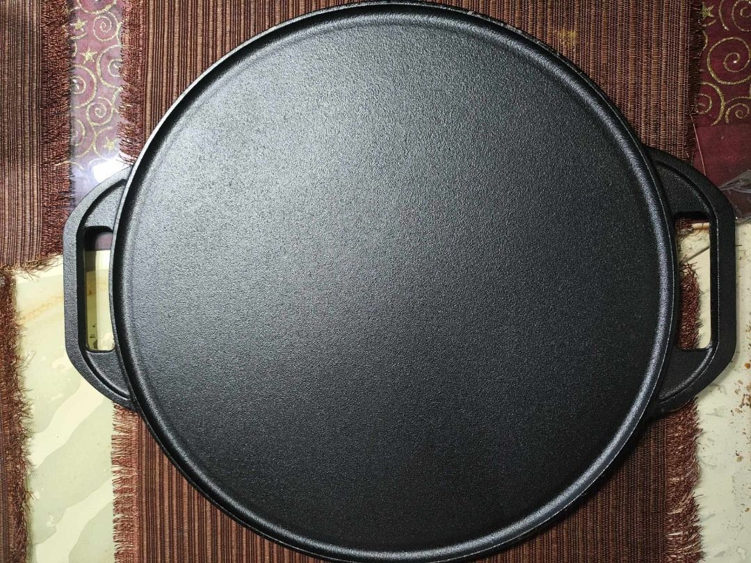 Fujida ROUND Reversible Grill/Griddle - ORIGINAL Cast Iron (Category: Cookware & Accessories) located in Manila. Submitted by bobbyyucommercial (Listing ID 1327024402, Image 1). Description: Fujida ROUND Reversible Grill/Griddle - ORIGINAL Cast Iron This double-burner Reversible Grill/Griddle functions as a dual cooking surface with both a smooth griddle and a ribbed grill. Fits over two stovetop burners, set both burners to the same temperature 