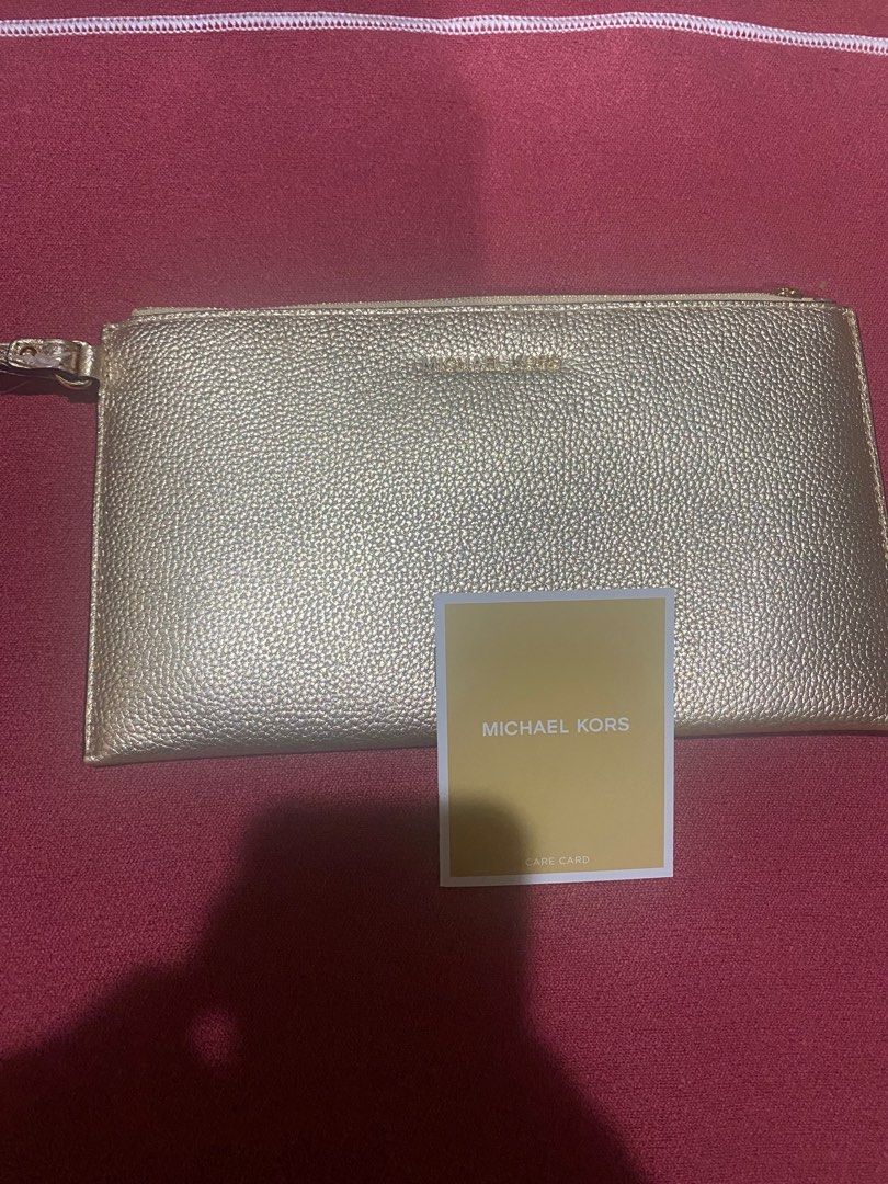 Gold MK Clutch (Category: Purses & Pouches) located in Cebu City. Submitted by gerikaquintos (Listing ID 1326936639, Image 2). Description: Brand New No Issues.