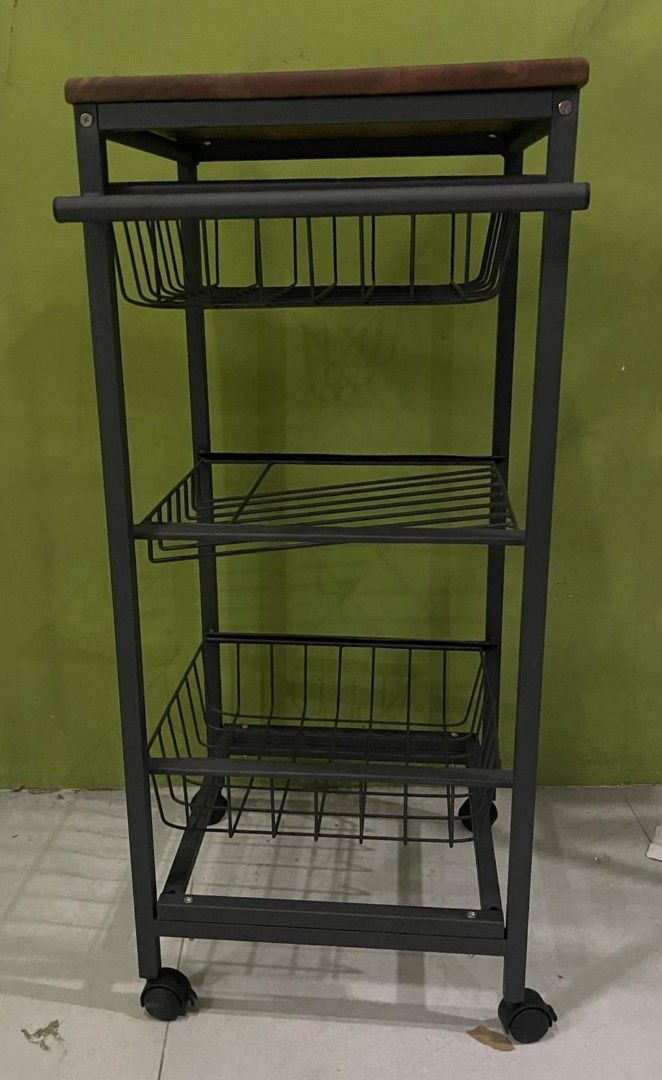 KWS129 Storage Organizer Kitchen Trolley Basket Rack (Category: Storage Boxes & Baskets) located in Manila. Submitted by rotalie (Listing ID 1326923405, Image 1). Description: KWS129 Storage Organizer Kitchen Trolley Basket Rack Mahogany wood table top Walnut color table top Gray metal frame 41L x 41W x 90H cm Delivery thru Lalamove or Grab express c/o buyer from Sampaloc Manila. Payment via bank transfer or GCash before shipping :) For further i
