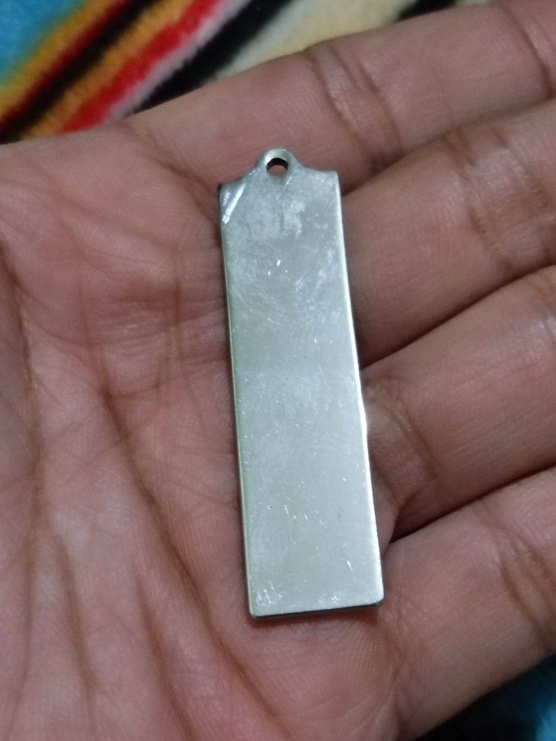 Louis Vuitton metal bag tag charm (Category: Luxury Accessories) located in Quezon City. Submitted by markgolveo (Listing ID 1326978640, Image 3). Description: Louis Vuitton metal bag tag charm chip damage on left side part.