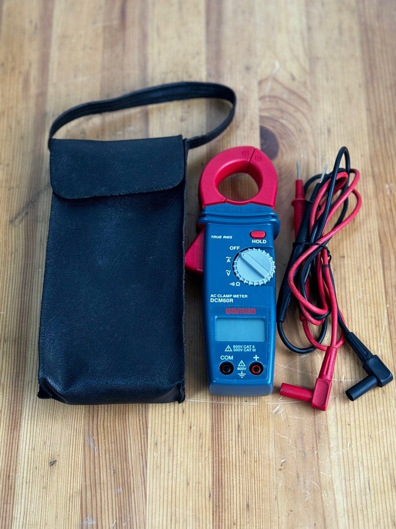Sanwa DCM60R Digital Clamp Meter Tester (Category: Construction Tools & Equipment) located in Talisay. Submitted by kim_rey (Listing ID 1326967964, Image 1). Description: ▪️True RMS ▪️Measurable AC 0.1A～600A ▪️ACV & Resistance measurement ▪️Small design & easy to carry ▪️Data hold ▪️Continuity check buzzer.