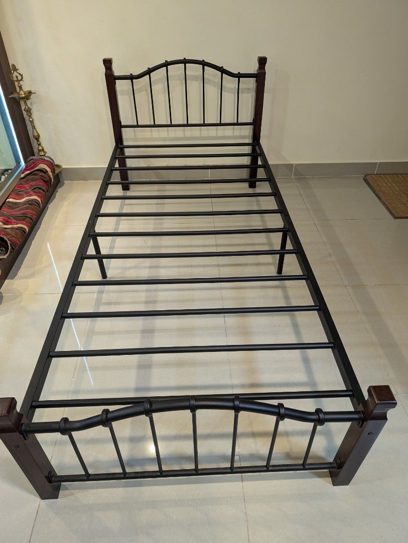 Single Bed (Category: Bed Frames & Mattresses) located in Kuala Lumpur. Submitted by joyfulstrawberry (Listing ID 1326960944, Image 1). Description: Colour : Black metal + Wood Panel Material : Metal + wood Dimension : L200cm x W90cm x H80cm Selling for RM 200. In perfect condition, rarely used. Please private message if interested. Thank you 🙏🏼.