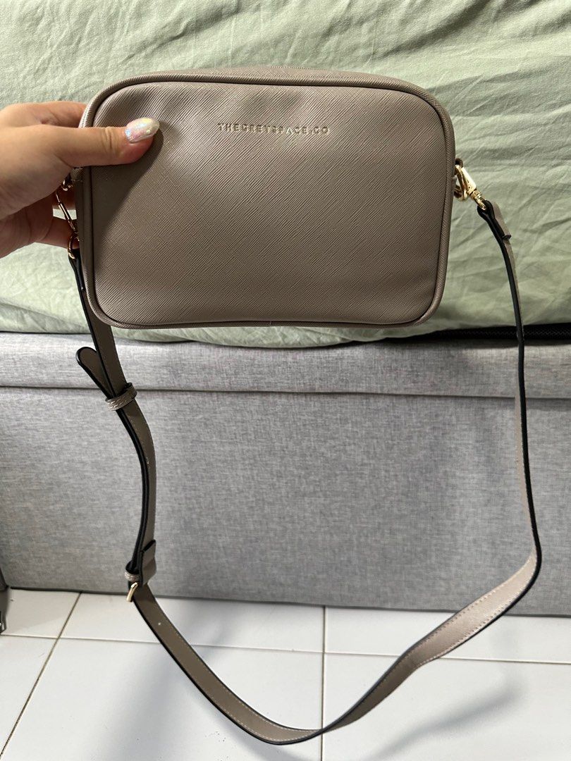 The grey space sling bag (Category: Cross-body Bags) located in Singapore. Submitted by seeingyou (Listing ID 1326940887, Image 2). Description: Lightly used for less than 5 times, no stratches at all Great for everyday use! Come with 2 dust bags Reasons for selling: too many bags.