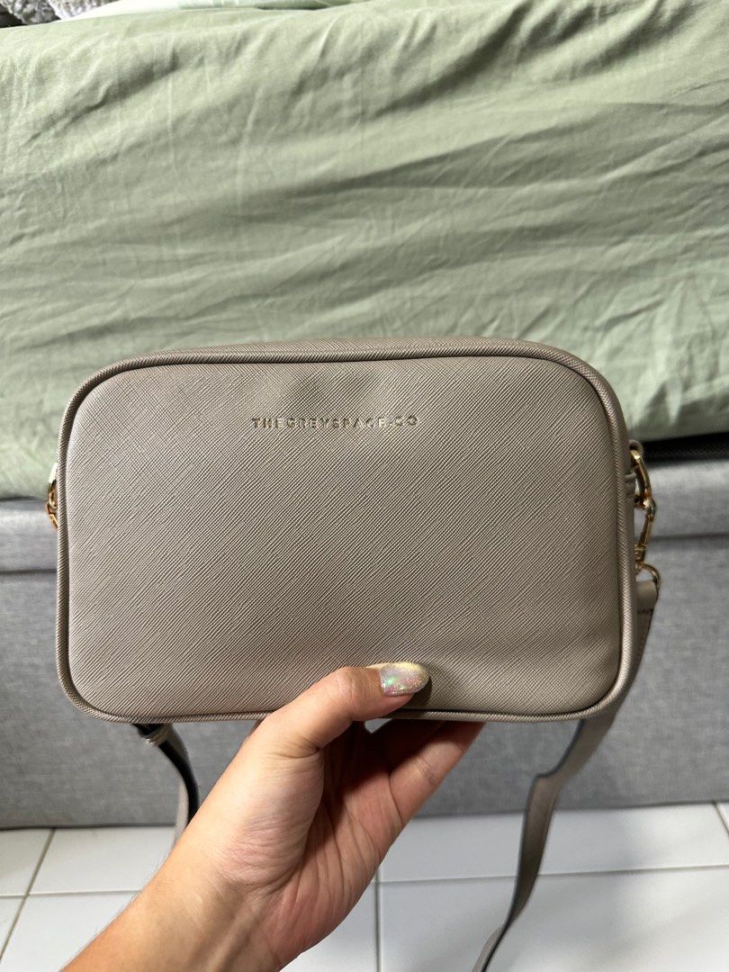 The grey space sling bag (Category: Cross-body Bags) located in Singapore. Submitted by seeingyou (Listing ID 1326940887, Image 1). Description: Lightly used for less than 5 times, no stratches at all Great for everyday use! Come with 2 dust bags Reasons for selling: too many bags.