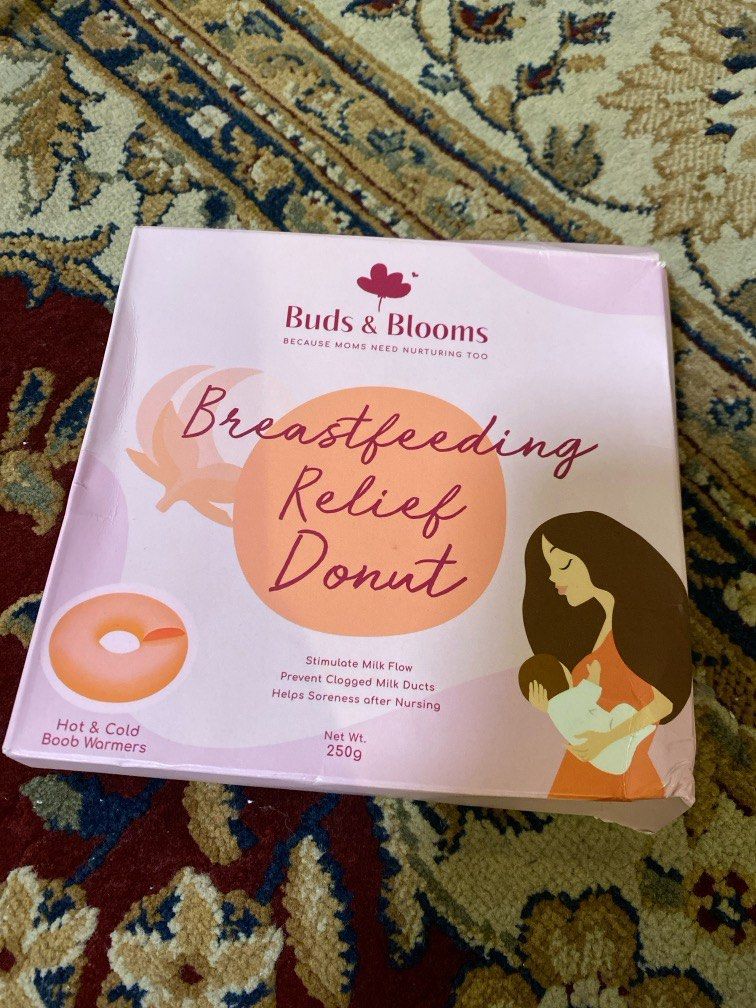 Buds & Blooms Breastfeeding Donut (Category: Breastfeeding & Bottle Feeding) located in Quezon City. Submitted by cdgextra (Listing ID 1327086508, Image 3). Description: never been used! still in the box :) The Buds & Blooms Breast Relief Doughnut is a comfortable warm compress specially fitted for breastfeeding mothers. The cut out in the middle is designed to avoid the sensitive nipple area. WARM: Moms can microwave the doughnut and apply it as