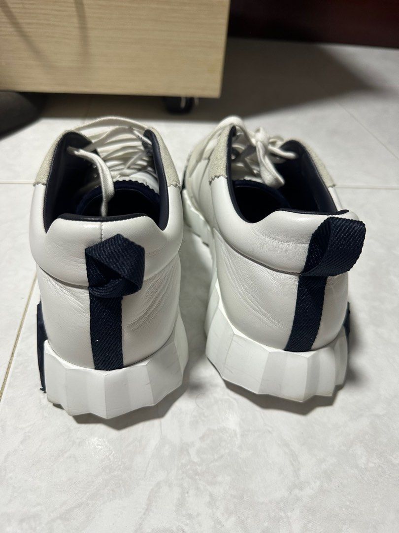 Hermes Bouncing (Category: Sneakers & Footwear) located in Singapore. Submitted by gerald14 (Listing ID 1327044183, Image 2). Description: Selling a like new Hermes Bouncing. Condition like new. Size 45. Sneaker in calfskin and suede goatskin. Light sole with contrasting design for a versatile and modern look. Made in Italy Sole height: 4 cm Bought Nov 2023. Wore only on occasions, which was about 5 times or less. Comes with Box. Kindly see last 