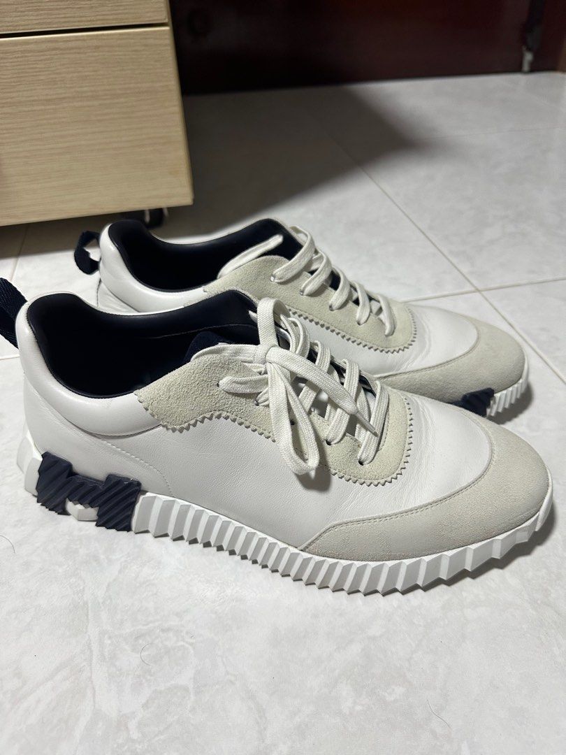 Hermes Bouncing (Category: Sneakers & Footwear) located in Singapore. Submitted by gerald14 (Listing ID 1327044183, Image 1). Description: Selling a like new Hermes Bouncing. Condition like new. Size 45. Sneaker in calfskin and suede goatskin. Light sole with contrasting design for a versatile and modern look. Made in Italy Sole height: 4 cm Bought Nov 2023. Wore only on occasions, which was about 5 times or less. Comes with Box. Kindly see last 