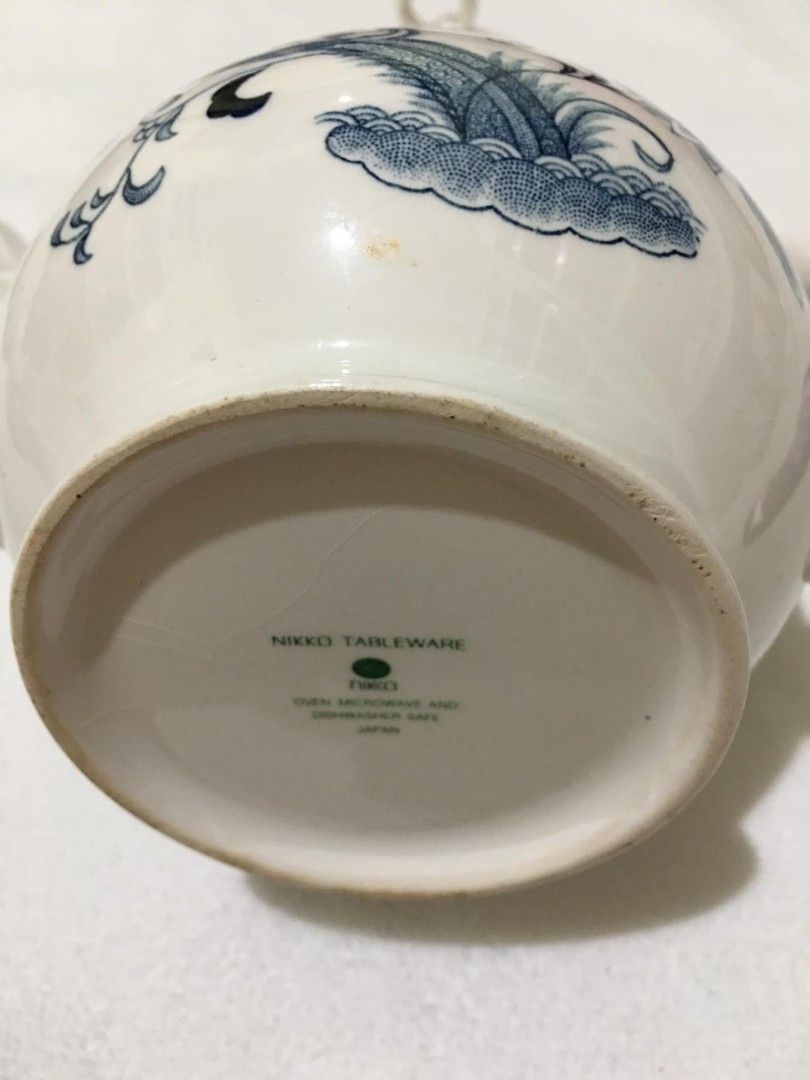 Nikko Tableware Tea Pot (Category: Coffee & Tea Tableware) located in San Jose del Monte. Submitted by eivon29 (Listing ID 1327190482, Image 3). Description: see picture. It has crazes but overall it is still usable and beautiful, and needs cleaning..