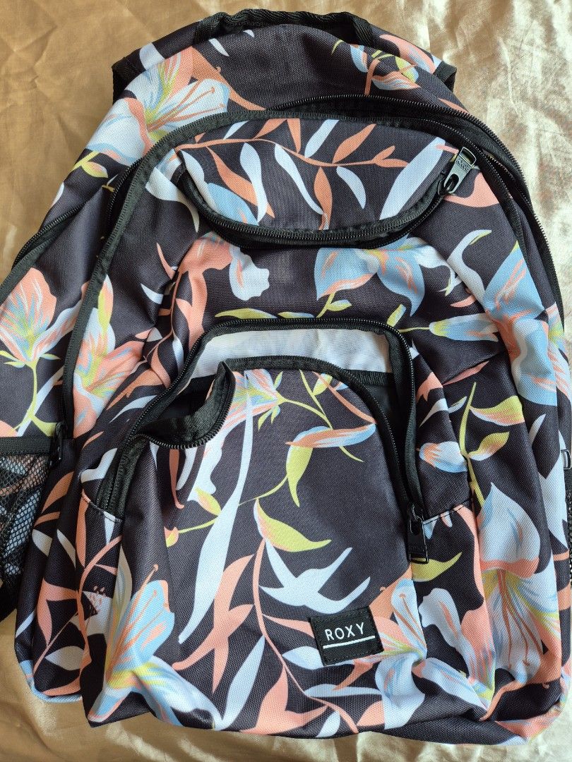 Roxy Backpack (Category: Backpacks) located in Singapore. Submitted by coolearth_.forest (Listing ID 1327077594, Image 1). Description: used a few times but looks food still as well maintained. alot of compartments. got 2 sides can put bottles & umbrella. got laptop compartment. can also hook keys on the key hook. a very good bag for someone with alot of stuff to lug around..