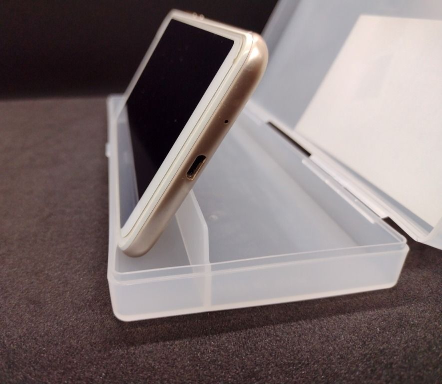 Smartphone Holder / Stand / Accessory Case - Made in Japan (Category: Mounts & Holders) located in Quezon City. Submitted by mondy_mond (Listing ID 1327103634, Image 1). Description: This Smartphone Holder / Stand / Accessory Case... *Made in Japan (See image #6, #9) *Functions as horizontal stand/holder for cellphone (See images #2, #3, #4, #7) *Serves as storage case for accessories (smartphone pin, extra SIM card, pick, USB cable, pen, microfi