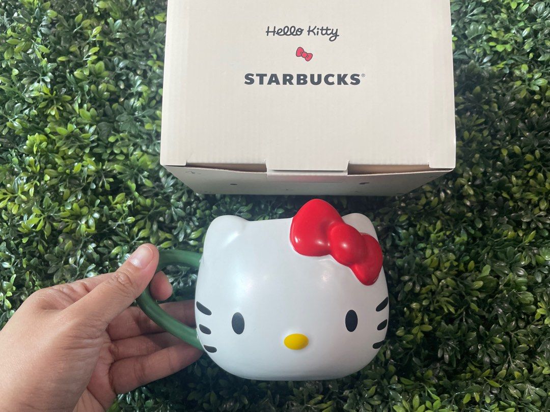 Starbucks x Hello Kitty collab ceramic mug (Category: Coffee & Tea Tableware) located in Cainta. Submitted by j.c.v_68 (Listing ID 1327154102, Image 1). Description: 100% original / authentic 💯 Comes with box & paper bag *collector’s item.