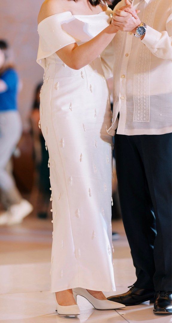 Zia Wycoco Wedding Dress (Category: Evening dresses & gowns) located in Makati City. Submitted by cbcchua (Listing ID 1327127953, Image 1). Description: Designer: Zia Wycoco Size: Bust - 36” Waist - 30.5” Hip - 39” Waist to Hem - 36” Current condition: Used for the reception only. Stored in garment bag. Dress Description: Cuff offshoulder, fitted corset bodice, fitted pencil cut skirt with slit at the back, finished with pearl-head buttons at the