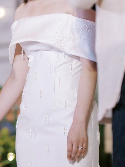 Zia Wycoco Wedding Dress (Category: Evening dresses & gowns) located in Makati City. Submitted by cbcchua (Listing ID 1327127953, Image 2). Description: Designer: Zia Wycoco Size: Bust - 36” Waist - 30.5” Hip - 39” Waist to Hem - 36” Current condition: Used for the reception only. Stored in garment bag. Dress Description: Cuff offshoulder, fitted corset bodice, fitted pencil cut skirt with slit at the back, finished with pearl-head buttons at the
