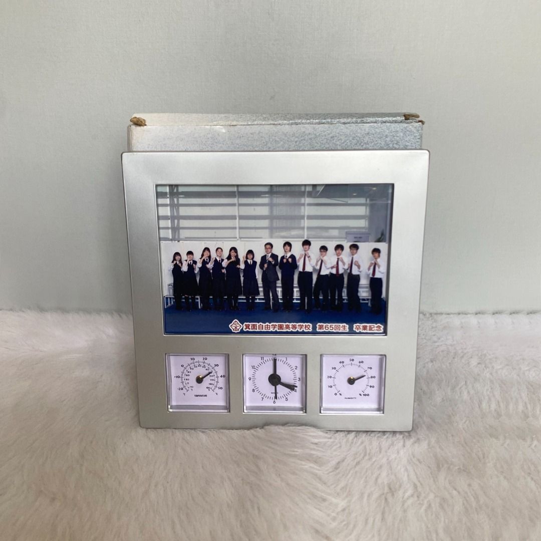 Japan Silver Photo Frame with Clock Thermo (Category: Frames & Pictures) located in Consolacion. Submitted by posh_avenue_home (Listing ID 1327242328, Image 1). Description: New with box. From Japan. 7" x 7"..