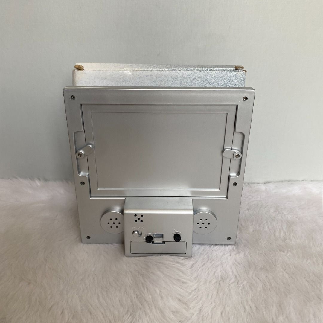 Japan Silver Photo Frame with Clock Thermo (Category: Frames & Pictures) located in Consolacion. Submitted by posh_avenue_home (Listing ID 1327242328, Image 2). Description: New with box. From Japan. 7" x 7"..