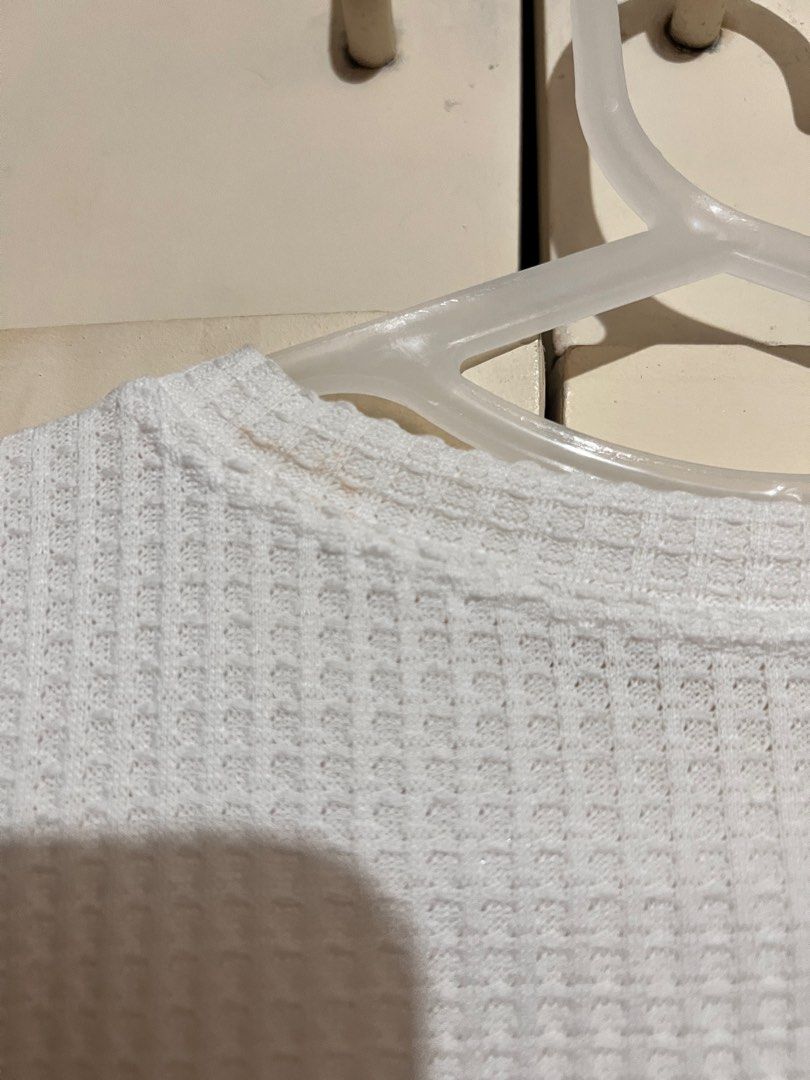 Taytay White Waffle Shirt (Category: Shirts) located in Rizal. Submitted by nookstash (Listing ID 1327242089, Image 3). Description: Has a stain on collar and some loose threads! ✨ -FREE SIZE -Slightly Sheer Get this and another top of same price at ₱50!.