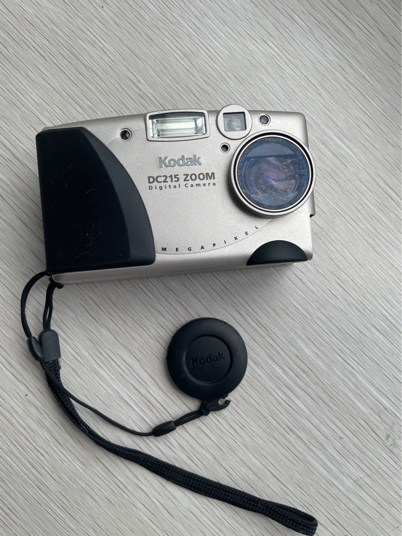 🇯🇵 Kodak DC215 Zoom Point & Shoot Digital Camera (Category: Cameras) located in Quezon City. Submitted by shopgood_mnl (Listing ID 1327493455, Image 1). Description: - no battery cover - selling as is, untested.