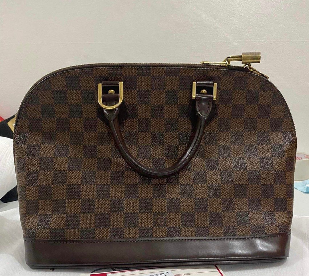 Authentic LV Alma Damier (Category: Luxury Bags & Wallets) located in Cagayan de Oro. Submitted by eloisag (Listing ID 1327428885, Image 2). Description: Selling my preloved LV Alma Damier (medium size) bag purchased from JLCC by Christian Carlos (famous online seller from Japan). 100% authentic. Only flaw is missing key. Can send more pictures and receipt for reference. Slightly negotiable. RFS: decluttering.
