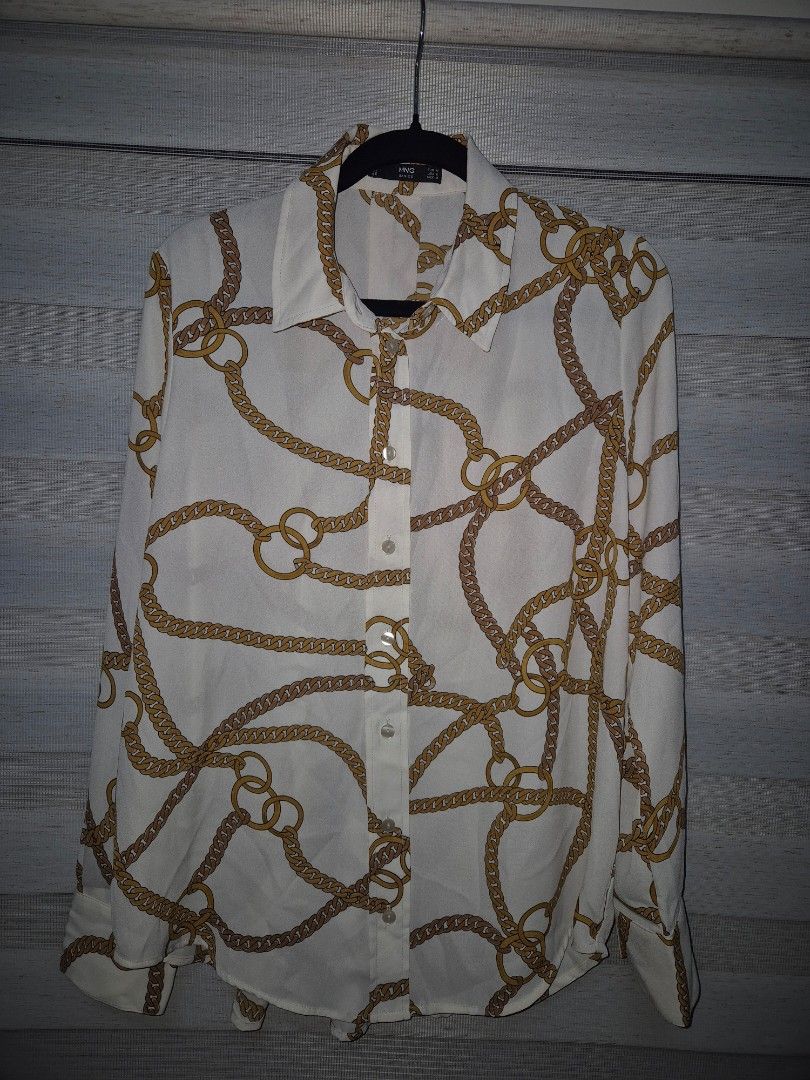 Mango - Chain Print Shirt (Category: Blouses) located in Quezon City. Submitted by offthesehands (Listing ID 1327528593, Image 2). Description: Brand: Mango (womens) Color: Cream and Gold Type: Relaxed fit Size: Medium | Size 6 Width > armpit to armpit: 54-56 cm > waist: 54 cm Length > shoulder down: 55 cm Price: P650 only!! Sells for P1.5k got it for P1.2k on the Z App Usage: used once lang for a special occasion never used it since RFS: declutt