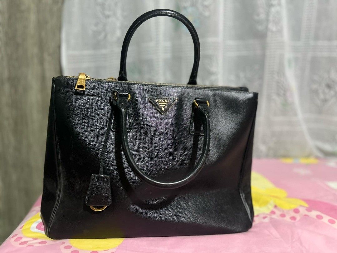Prada Saffiano lux (Category: Luxury Bags & Wallets) located in San Jose. Submitted by cheapest_thrill_closet (Listing ID 1327480411, Image 3). Description: used but not abuse! it's a personal owned bag..