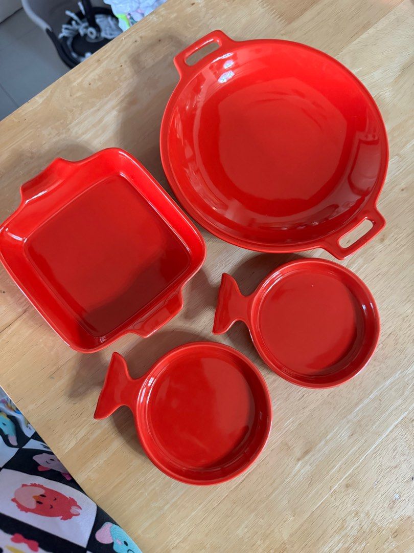 Red plates ceramic (Category: Dinnerware & Cutlery) located in Manila. Submitted by camshomecollections888 (Listing ID 1327415075, Image 2). Description: 1 shallow bowl 12 inches 1 Squre plate 9 inches 2 fish shape 71/2 inches Sizes handle to handle .