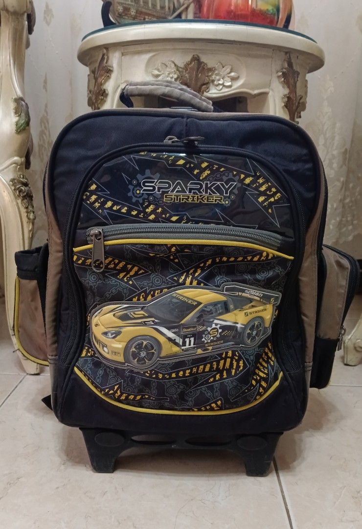 School Trolley bag (Category: Strollers) located in Taytay. Submitted by reese511 (Listing ID 1327408683, Image 1). Description: My son's Preloved school trolley Flaw: Hole sa lagayan ng tumbler and handle ng zipper. See pic..