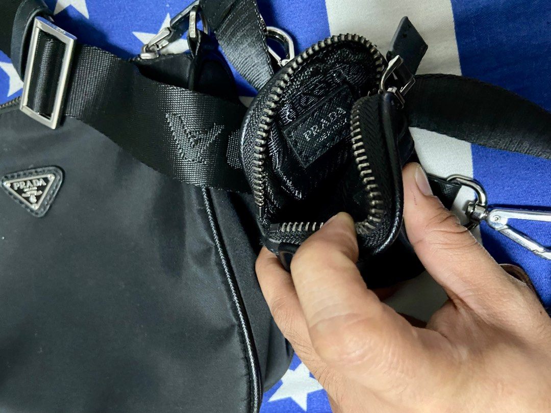 Frada Re-Edition 2000 black sling bag (Category: Luxury Bags & Wallets) located in Manila. Submitted by freddiectable (Listing ID 1327666834, Image 2). Description: Prada Re-Election 2000 sling black bag. Slightly used in very good condition. All zippers are intact. Metal hardware are still better. PM for more deets and negotiation.