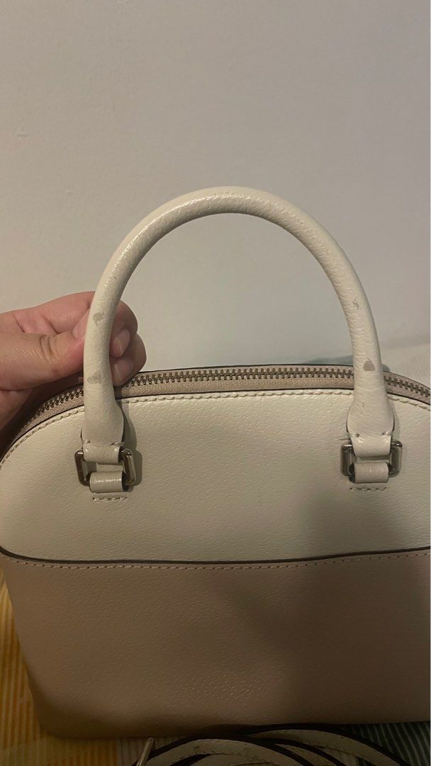 Kate Spade Mini Carli Crossbody Bag (Category: Cross-body Bags) located in Manila. Submitted by loismagsx (Listing ID 1327689985, Image 3). Description: Negotiable Rfs: Decluttering Flaws: rubs on back handle but not noticeable if will be worn as sling bag. Small stains barely noticeable also.