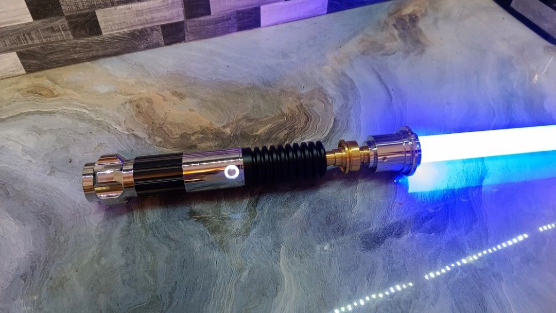 Obiwan Kenobi Duel Grade Lightsaber (Category: Action & Battle Toys) located in Manila. Submitted by Drumsticx (Listing ID 1327630942, Image 1). Description: Dynamic Sabers Obiwan Kenobi Lightsaber Brand New w/box, charging cable INFO: *Gesture Ignition *Multicolor Baselit *Light effects *Duel Grade Saber *Aluminum Metal Alloy Hilt *Polycarbonate Blade *Sound Volume Adjustment *Flash on clash effect *Blaster deflect effect *Lock-On effect *16 Sou