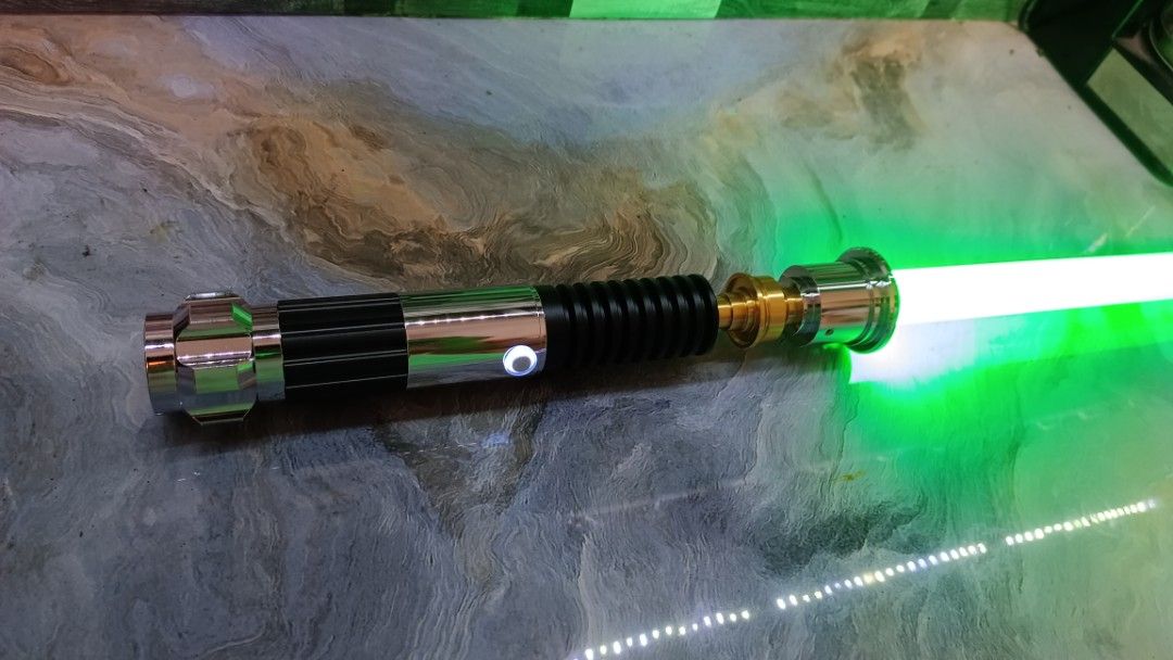 Obiwan Kenobi Duel Grade Lightsaber (Category: Action & Battle Toys) located in Manila. Submitted by Drumsticx (Listing ID 1327630942, Image 3). Description: Dynamic Sabers Obiwan Kenobi Lightsaber Brand New w/box, charging cable INFO: *Gesture Ignition *Multicolor Baselit *Light effects *Duel Grade Saber *Aluminum Metal Alloy Hilt *Polycarbonate Blade *Sound Volume Adjustment *Flash on clash effect *Blaster deflect effect *Lock-On effect *16 Sou