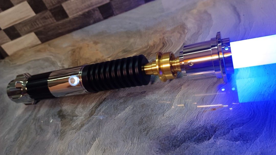 Obiwan Kenobi Duel Grade Lightsaber (Category: Action & Battle Toys) located in Manila. Submitted by Drumsticx (Listing ID 1327630942, Image 2). Description: Dynamic Sabers Obiwan Kenobi Lightsaber Brand New w/box, charging cable INFO: *Gesture Ignition *Multicolor Baselit *Light effects *Duel Grade Saber *Aluminum Metal Alloy Hilt *Polycarbonate Blade *Sound Volume Adjustment *Flash on clash effect *Blaster deflect effect *Lock-On effect *16 Sou